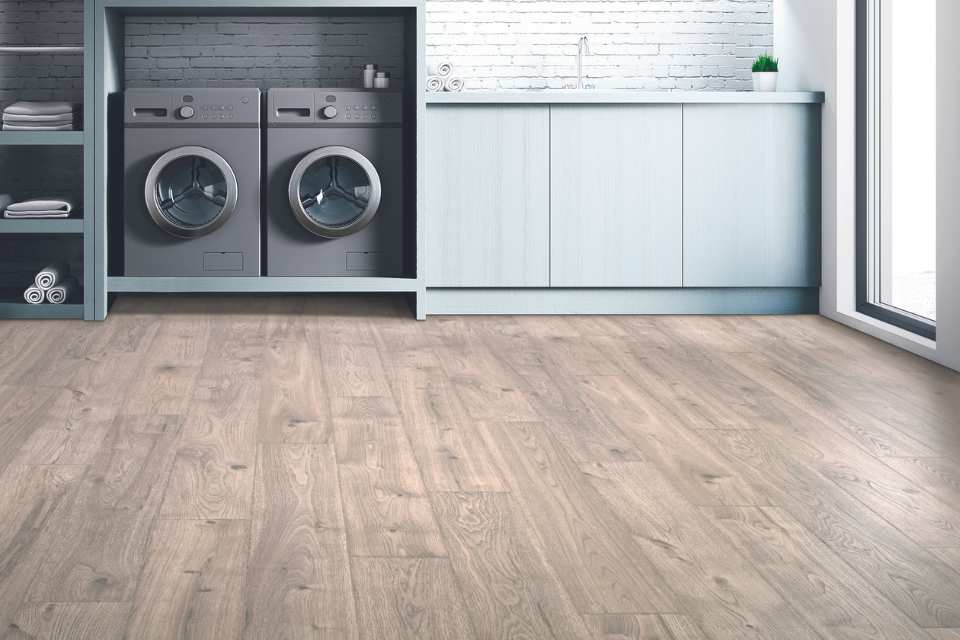 wood look luxury vinyl in modern airy laundry room